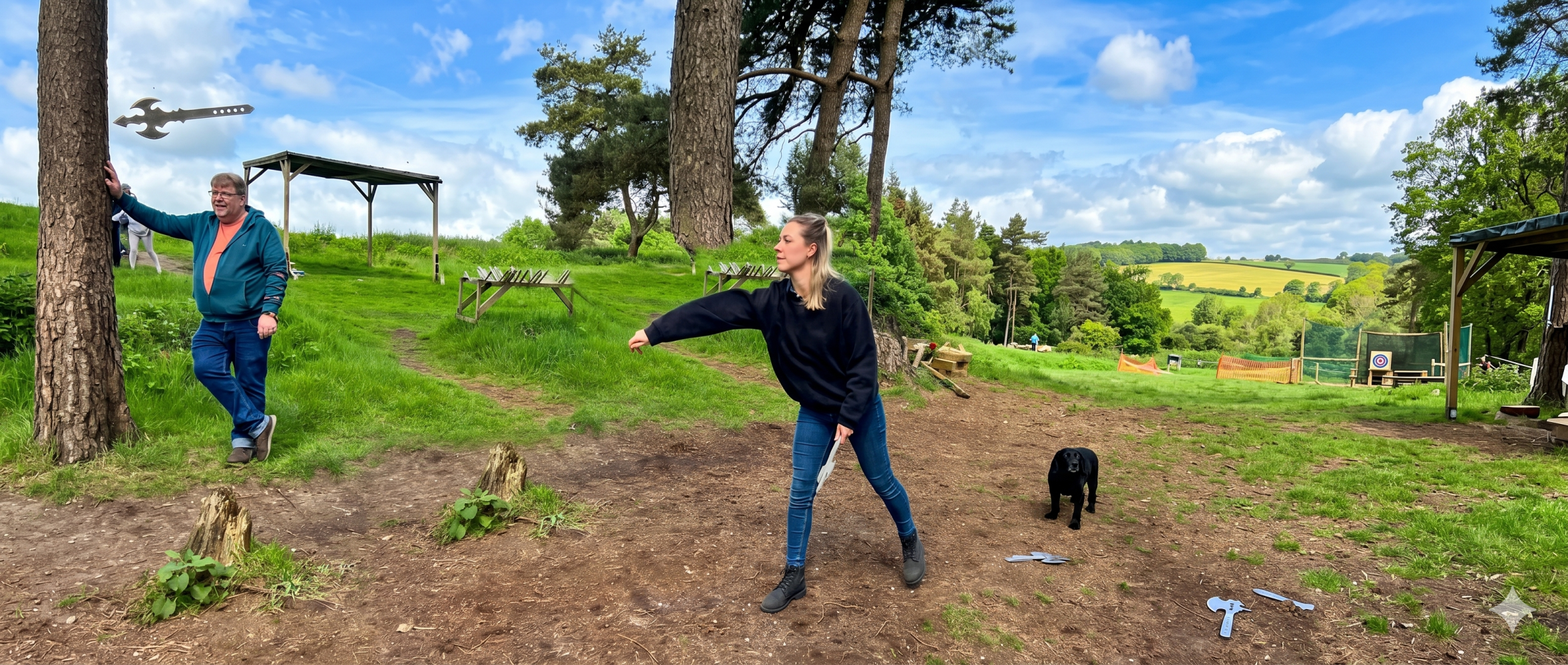 Woman in park throwing an axe at a tree target while a man and dog watch.
